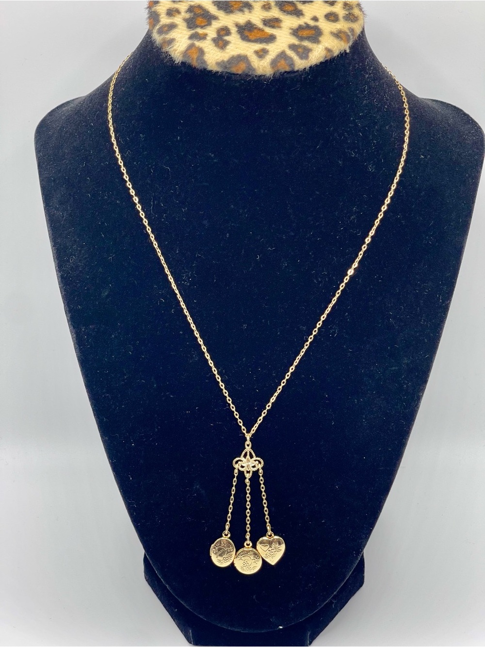 1928 Gold Tone Pendant Locket Charm Necklace with Three Dangling Charms